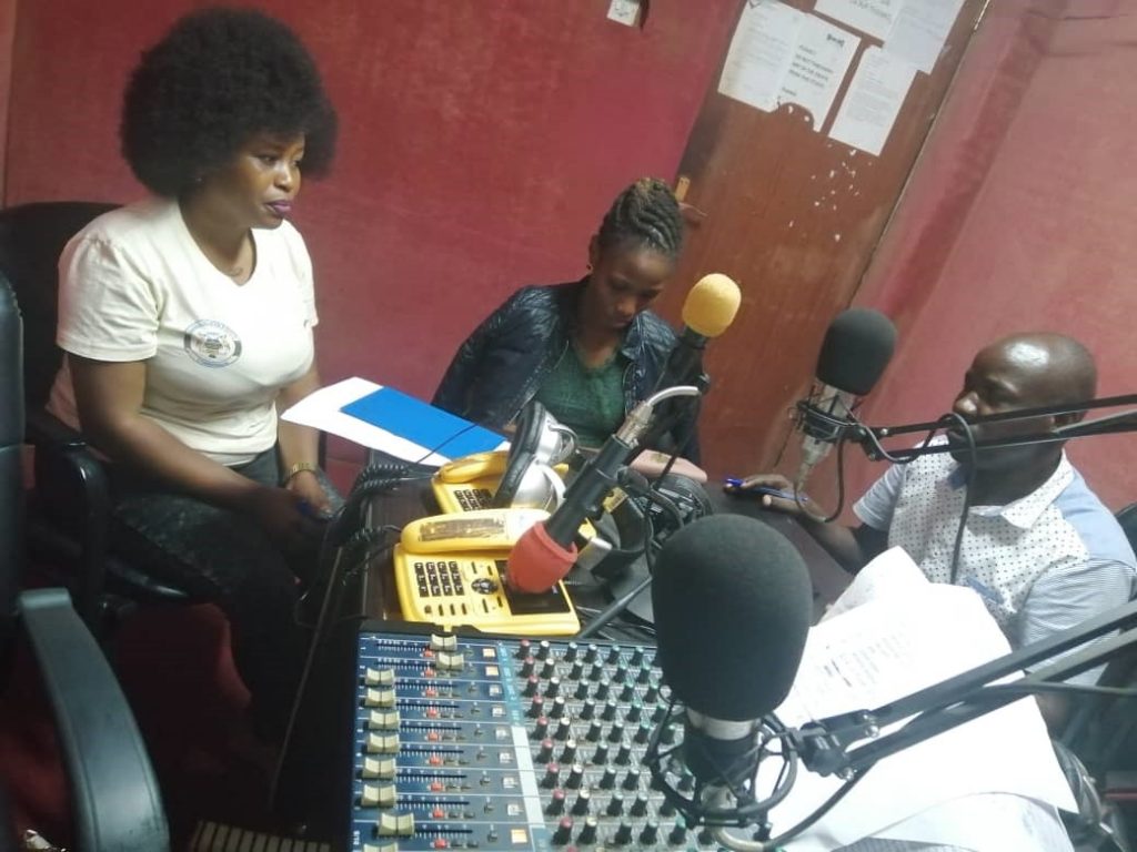 JCU staff participates at a live radio talkshow to reach out to the people of Bundibugyo