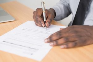 black person writing a will