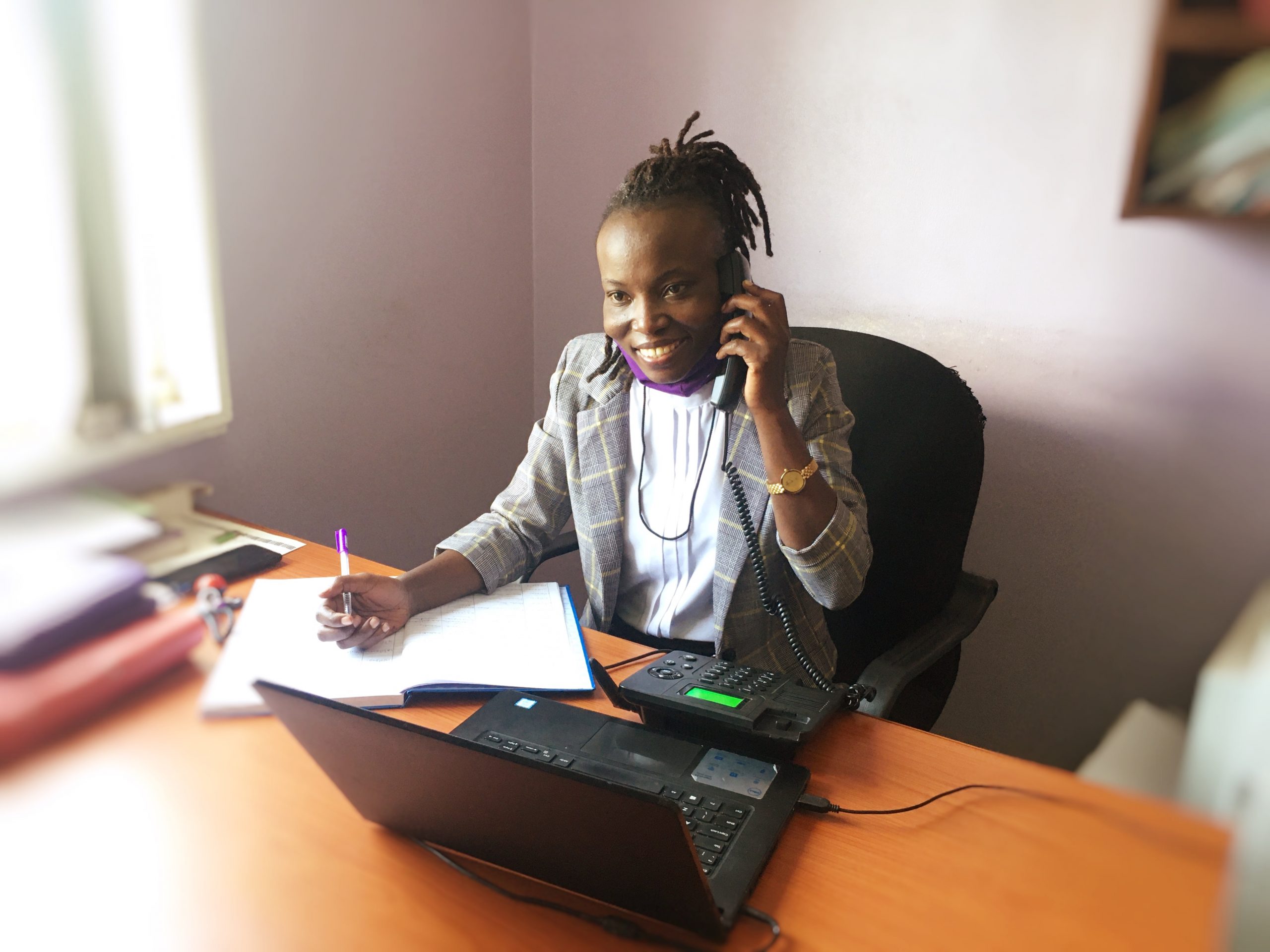 JCU employee answering toll-free telephone and giving legal advice